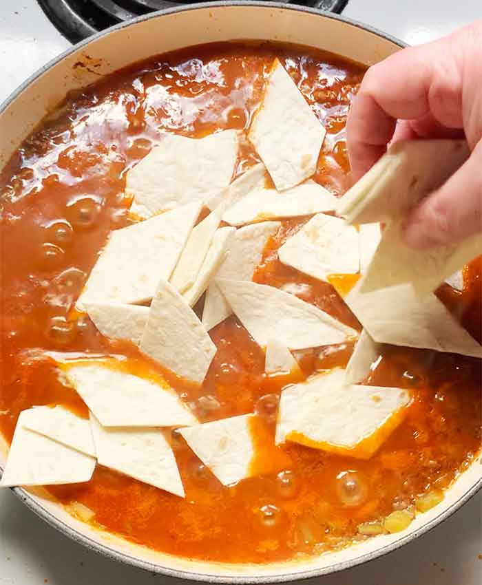 My chunky right hand spread diamond-shaped pieces of flour tortillas across the surface. Excluded spurtle is jelly.