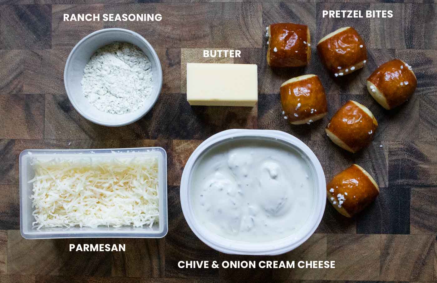 Prepped ingredients arranged on a wooden cutting board and labeled.