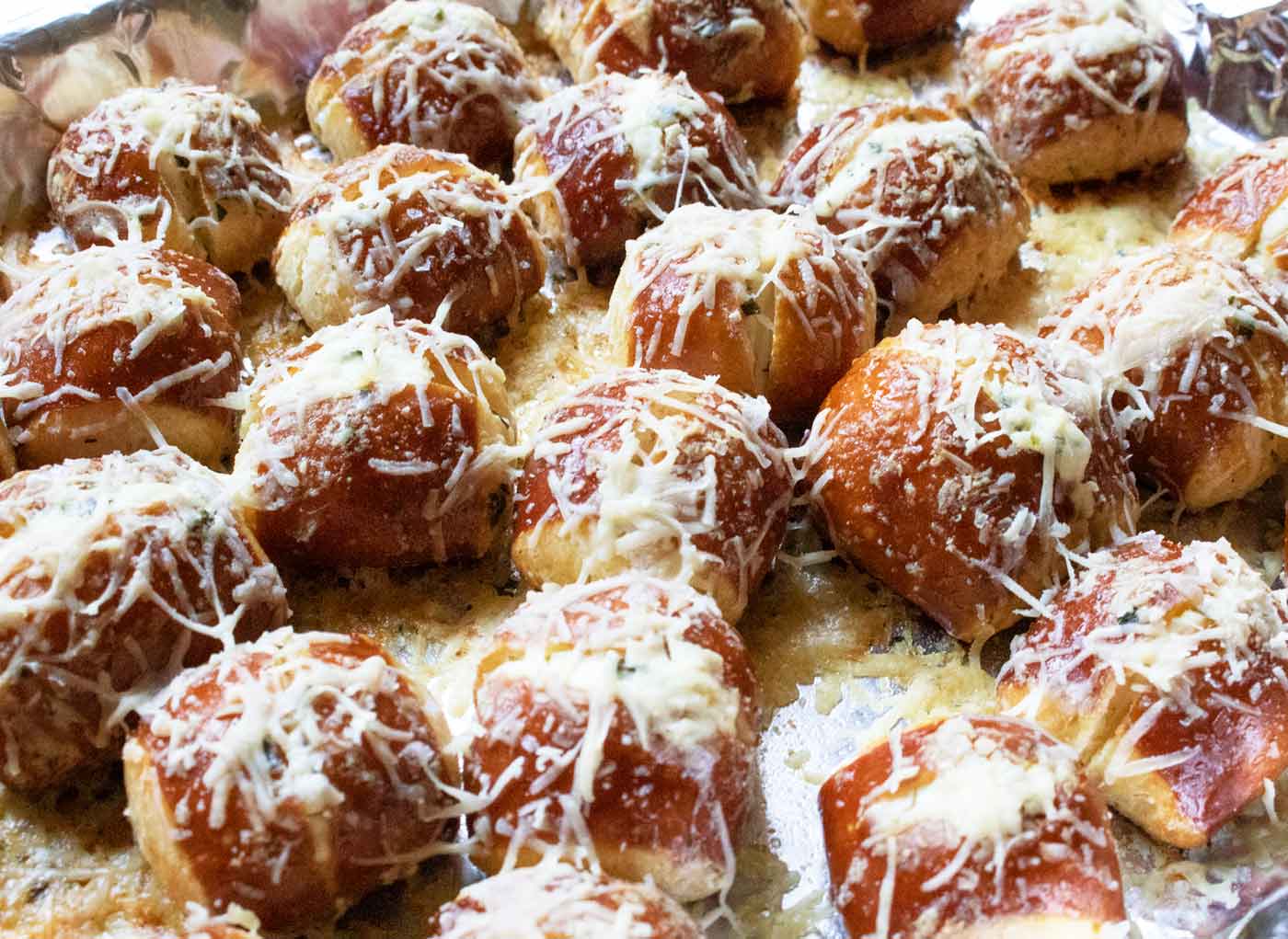 Freshly baked pretzel bites on the baking sheet.