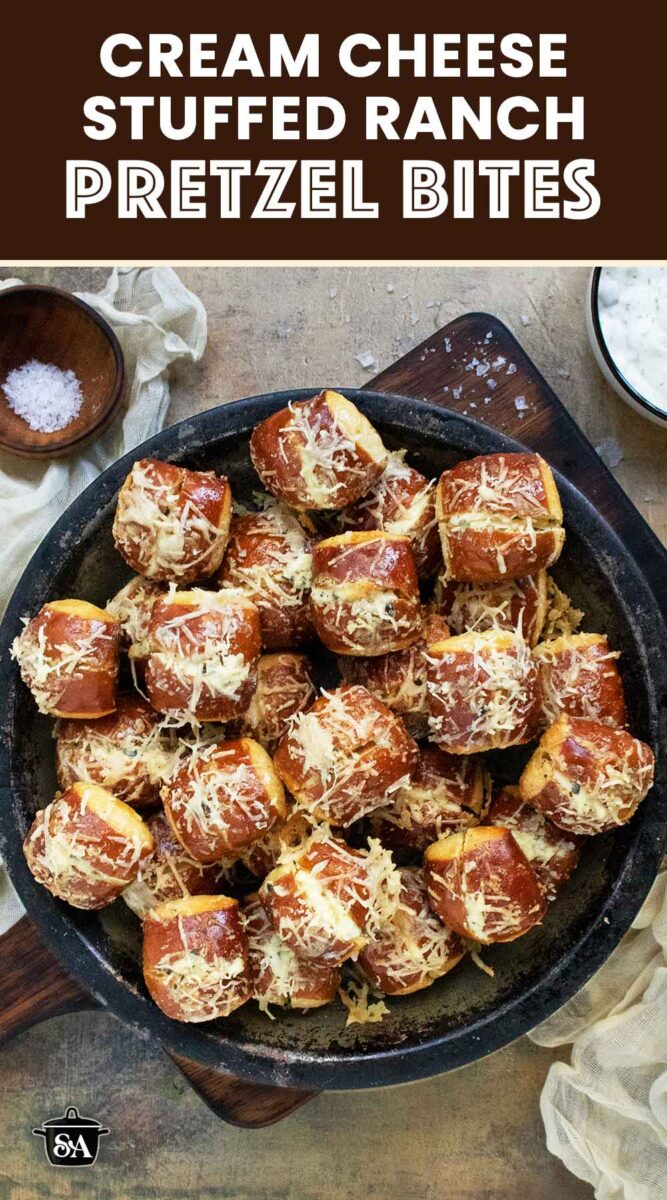 Pinterest pin image for Cream Cheese Stuffed Ranch Pretzel Bites featuring the pretzel bites on a plate.