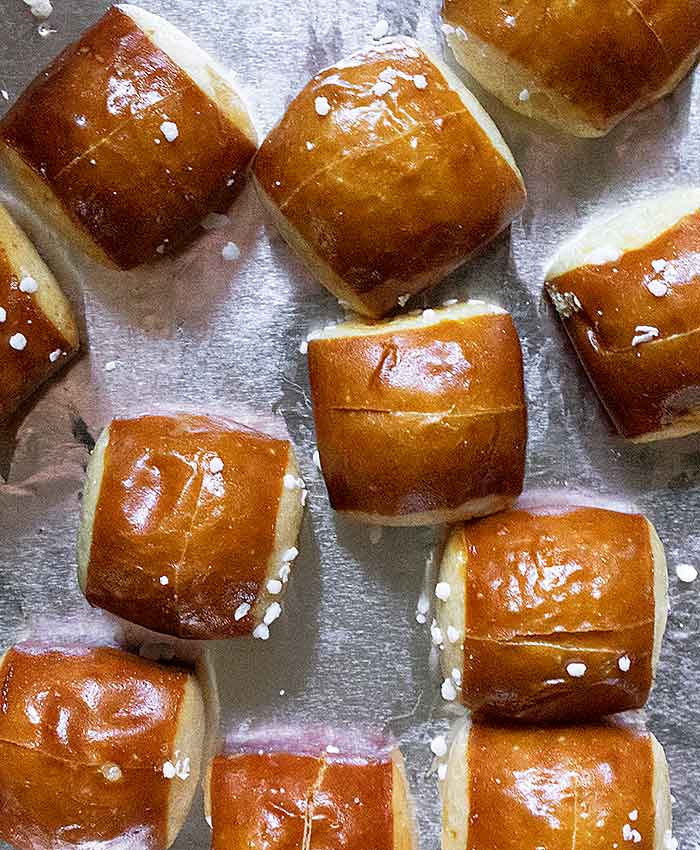 Close-up view of pretzels with slices on their tops.