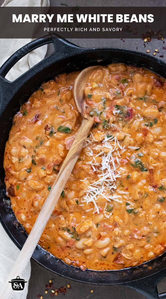Pinterest pin image for Marry Me White Beans, featuring the beans in a cast iron skillet.