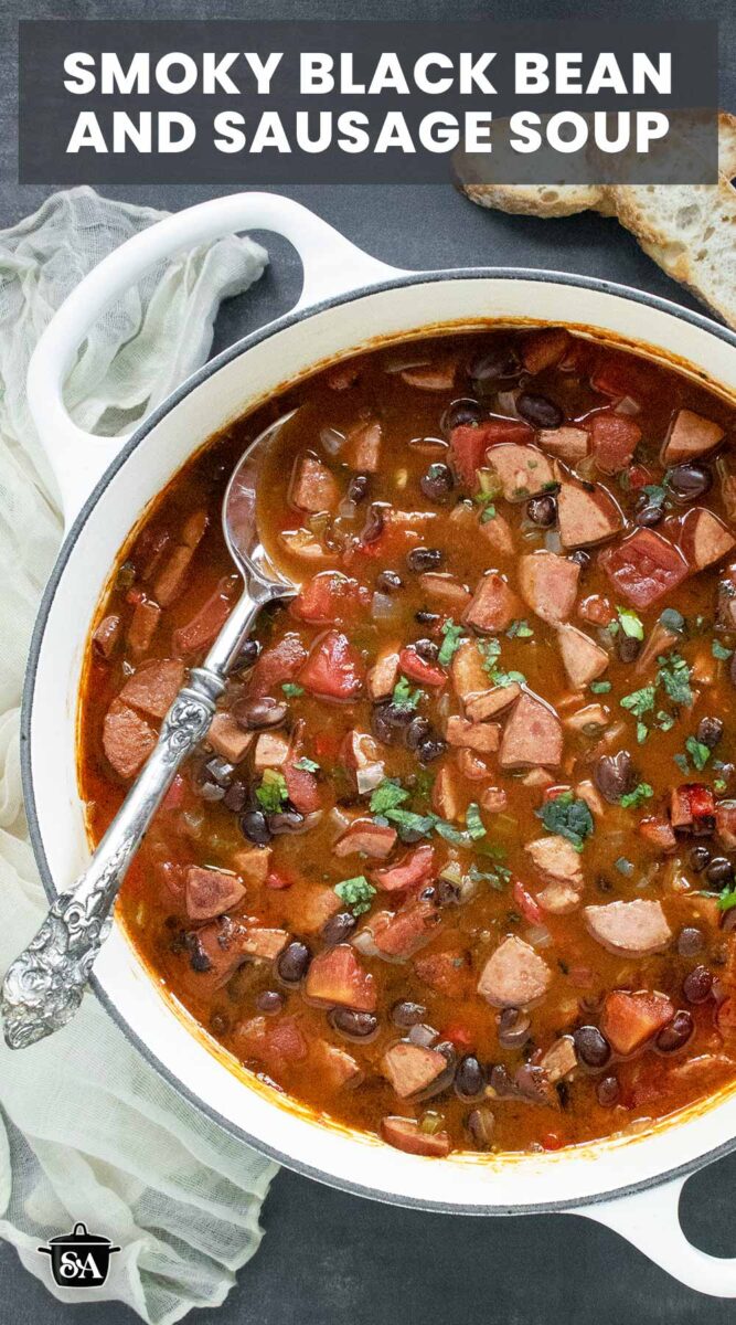 Pinterest pin image for Smoky Black Bean and Sausage Soup, featuring a pot of the soup.