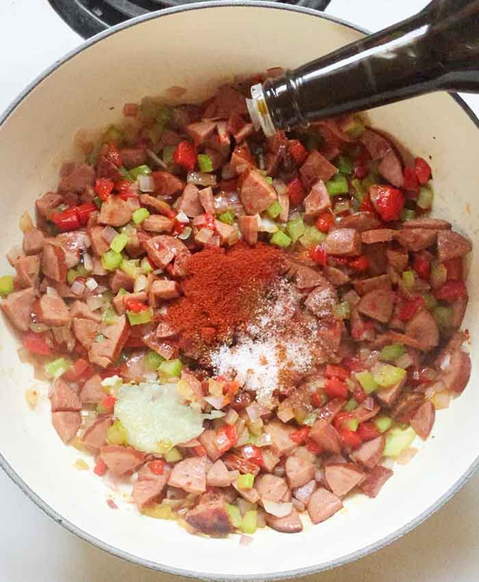 Add the spices and seasonings to the pot.