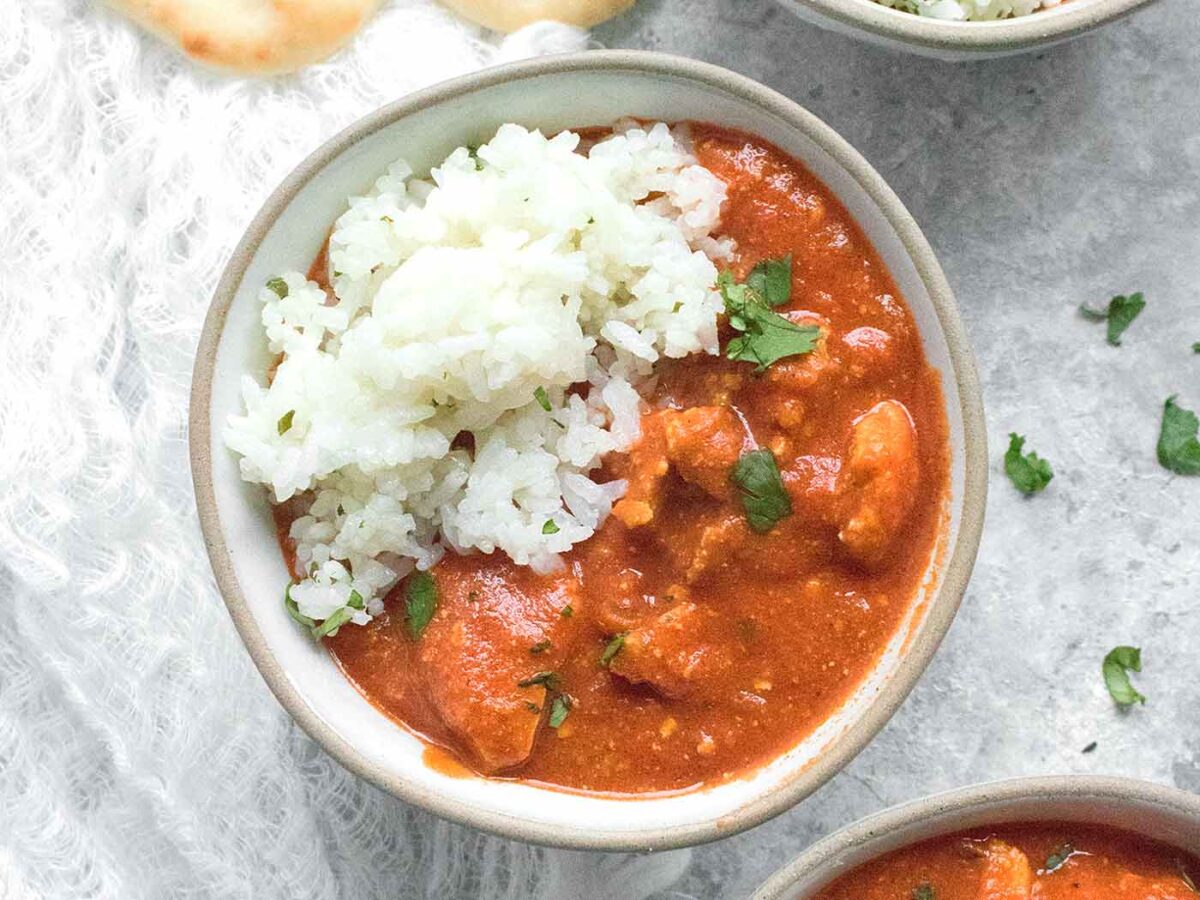 Chicken Tikka Masala in a bowl with rice.
