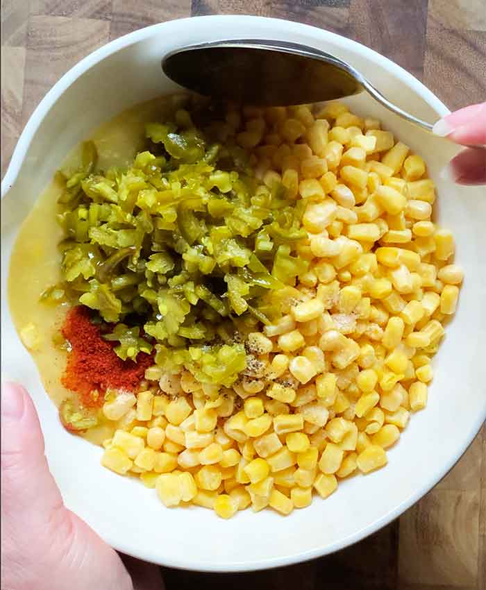 Stirring in the vegetables and spices.