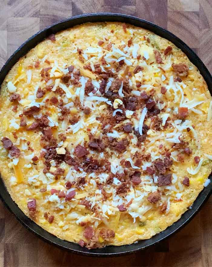 Top with more shredded cheese and bacon pieces for the final leg of the bake.