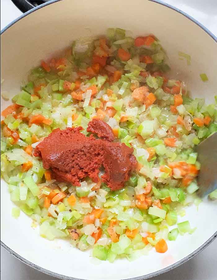Thai red curry paste stirred into the veggies.