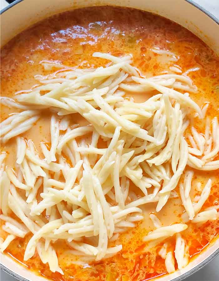 Drained pasta added to the soup.