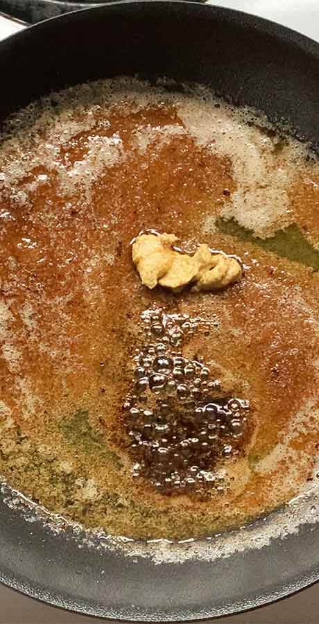 Finishing the glaze with some Dijon mustard and Worcestershire sauce.