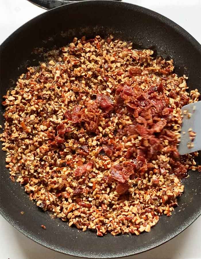 Adding in the crumbled, crispy bacon.