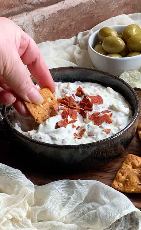 Testing it out for quality control purposes! Photo is my left hand dipping a pretzel chip into the dip.