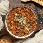 Overhead view of Rustic Lentil Soup in a ceramic bowl.