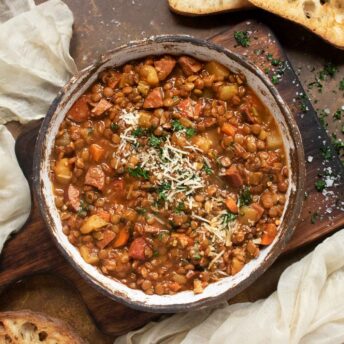 Overhead view of Rustic Lentil Soup in a ceramic bowl.
