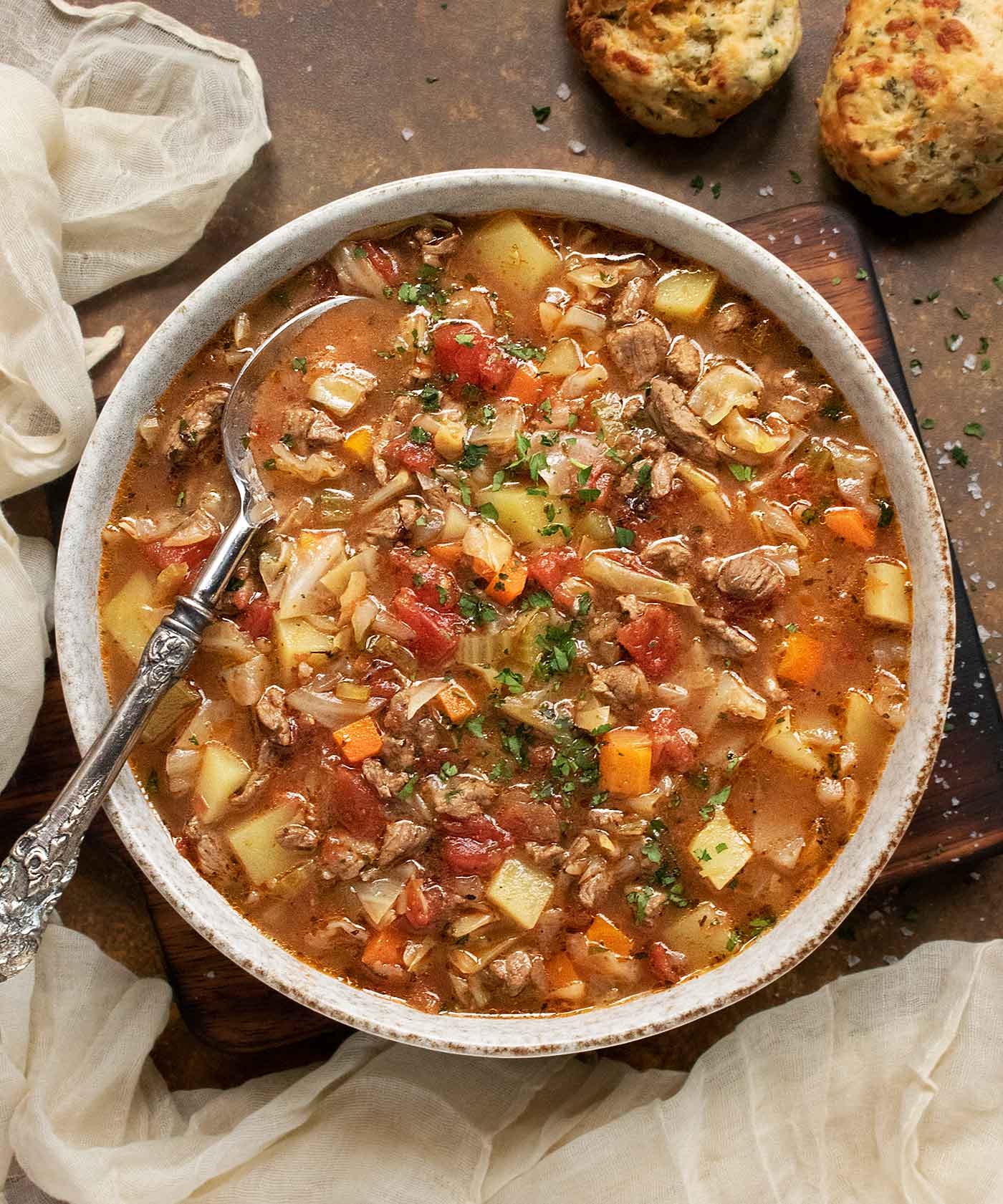 Overhead view of a bowl of Beef and Cabbage Soup.