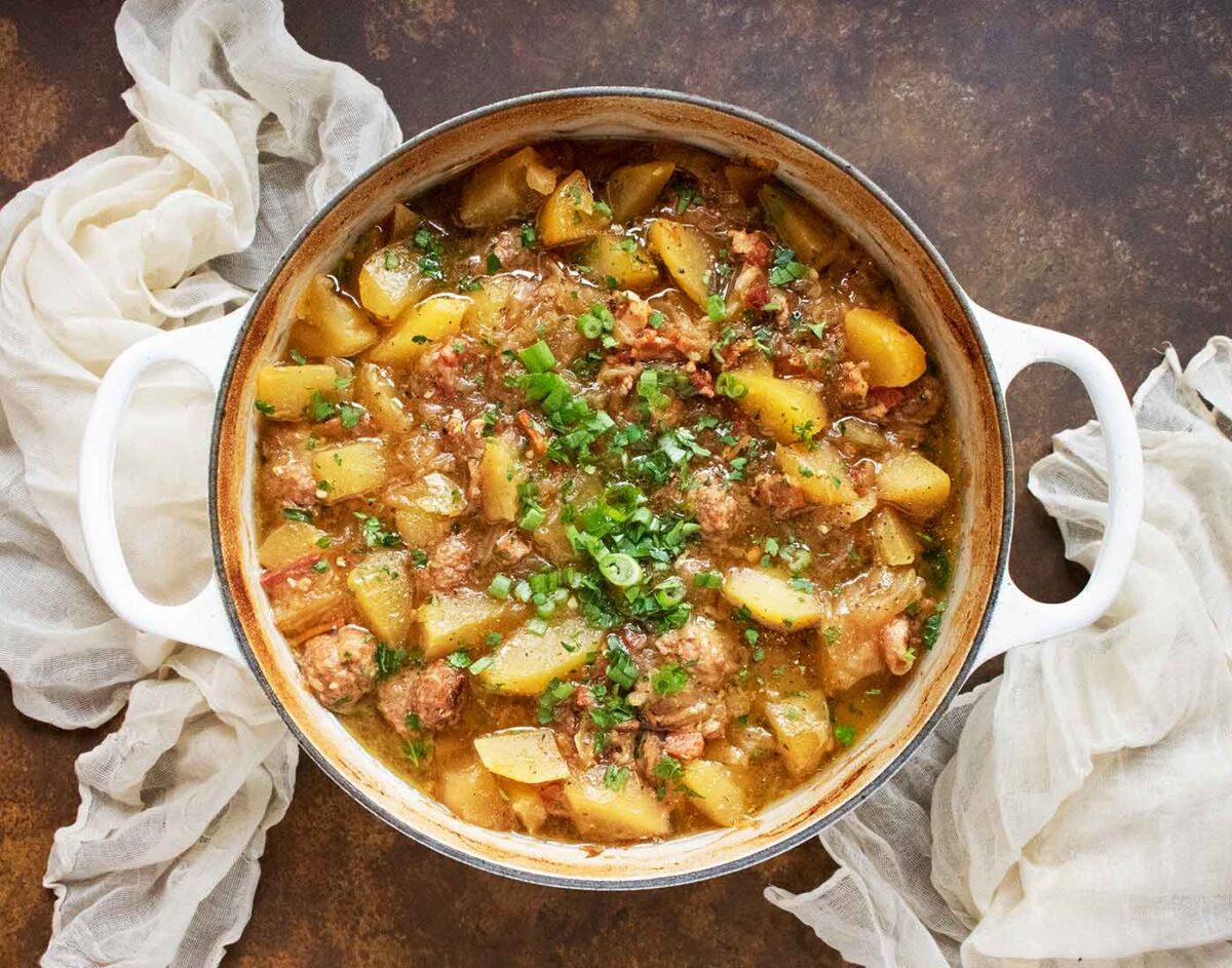 Overhead view of Dublin Coddle in a large Dutch oven.