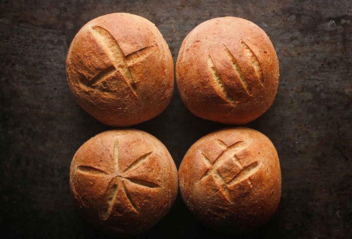 Overhead view of four Sourdough Rye Bread Bowls, ready to serve.