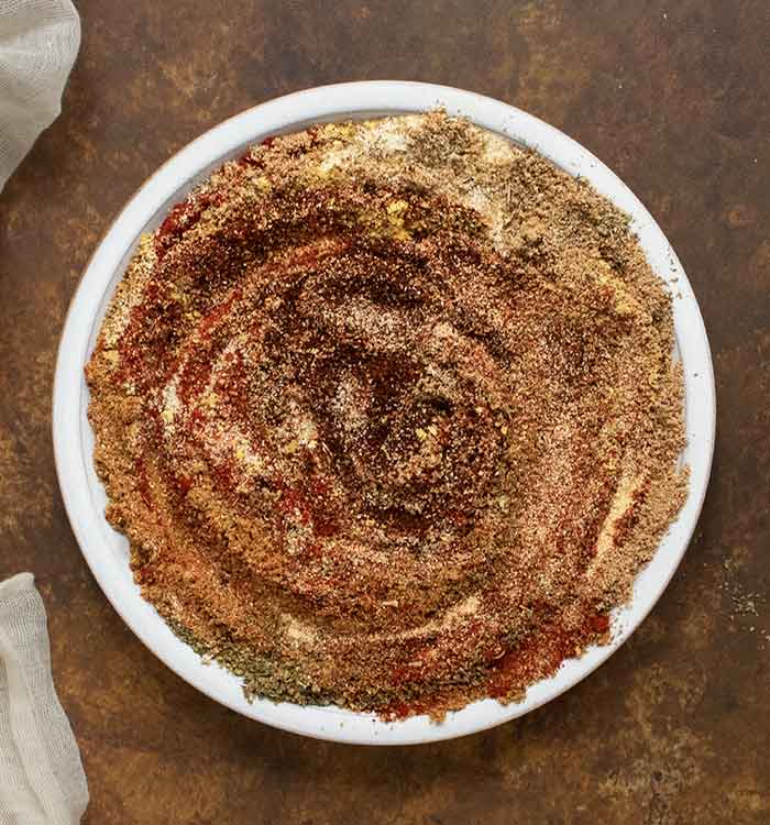 A swirl of spices on a white plate.