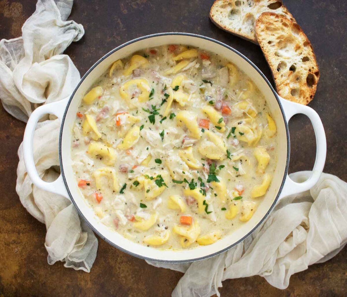 Cordon Bleu Tortellini Soup in a large white Dutch oven.