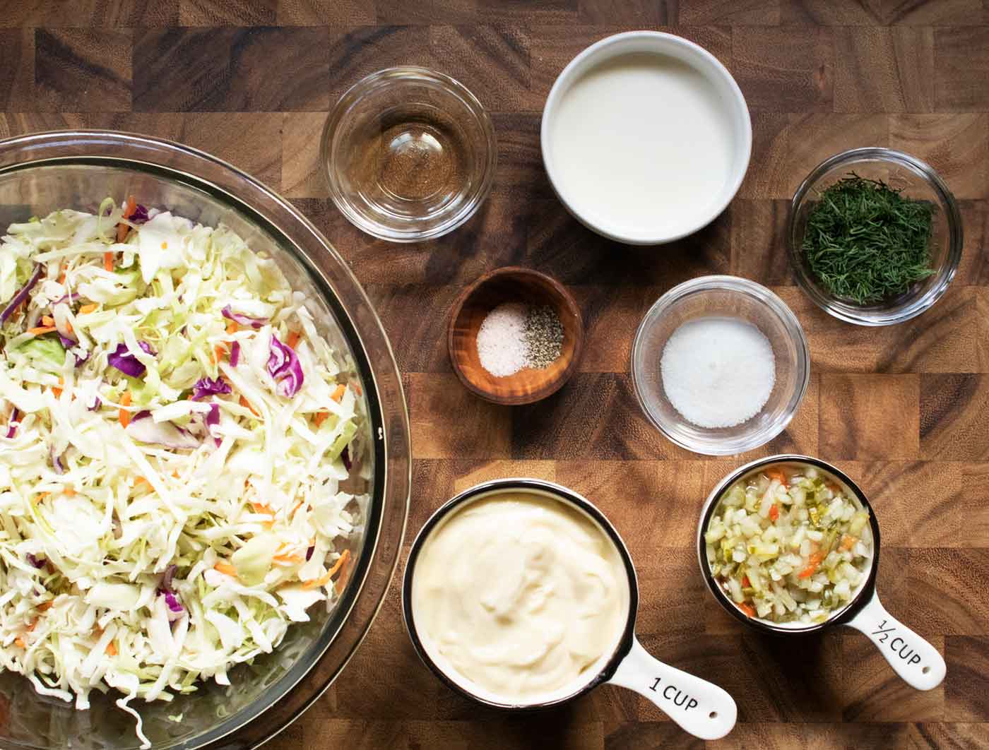 Ingredient for the slaw, measured out and arranged in individual containers.