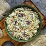 Overhead view of Pickle de Gallo Coleslaw in a green bowl.