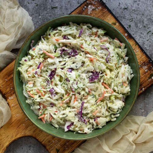 Overhead view of Pickle de Gallo Coleslaw in a green bowl.
