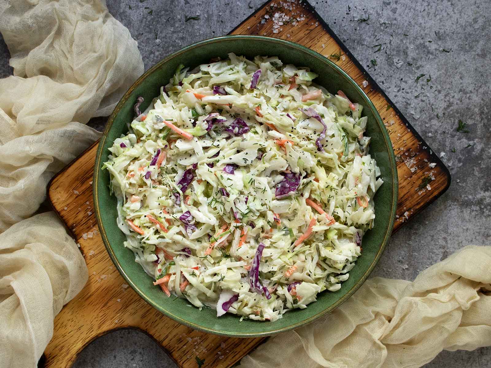 Overhead view of Pickle de Gallo Coleslaw in a green bowl.