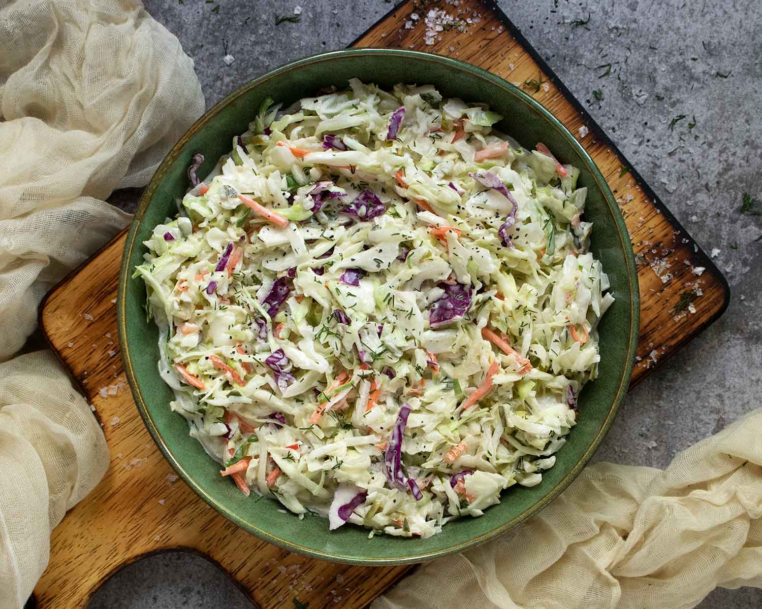 Overhead view of Pickle de Gallo Coleslaw in a green bowl.