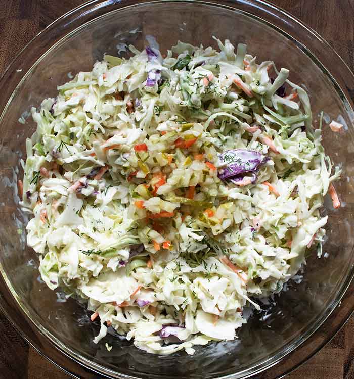 Adding more pickle de gallo to the slaw.