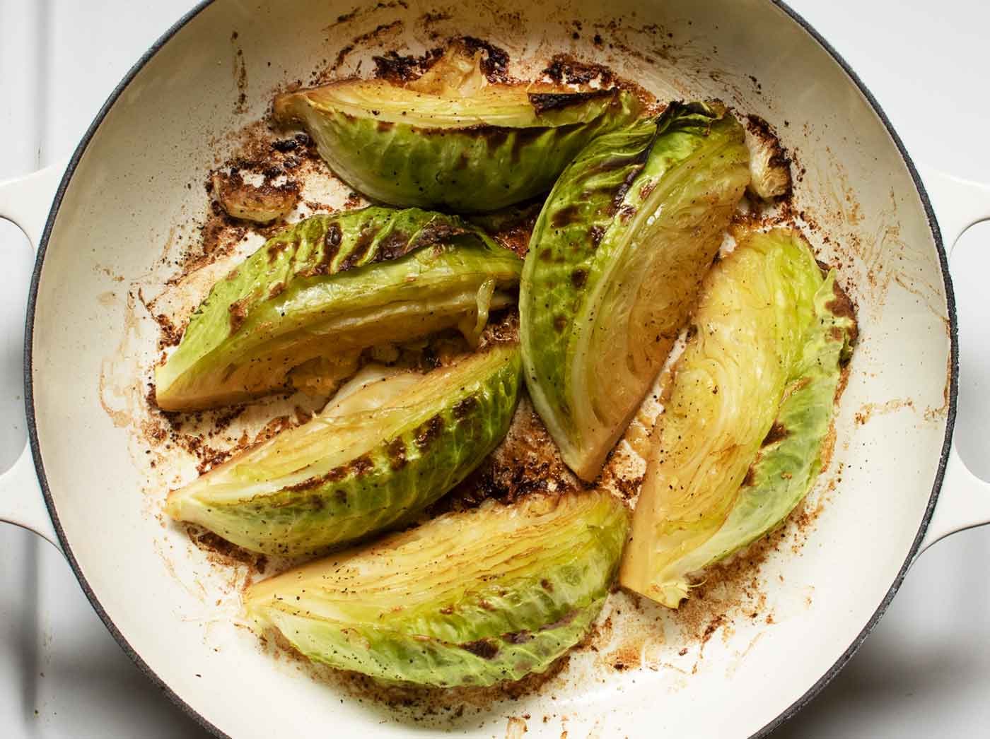 Cabbage wedges roasted, charred, and ready to serve.