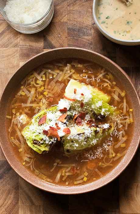 Finish the broth bowls by sprinkling grated parm and crumbled bacon over the cabbage.