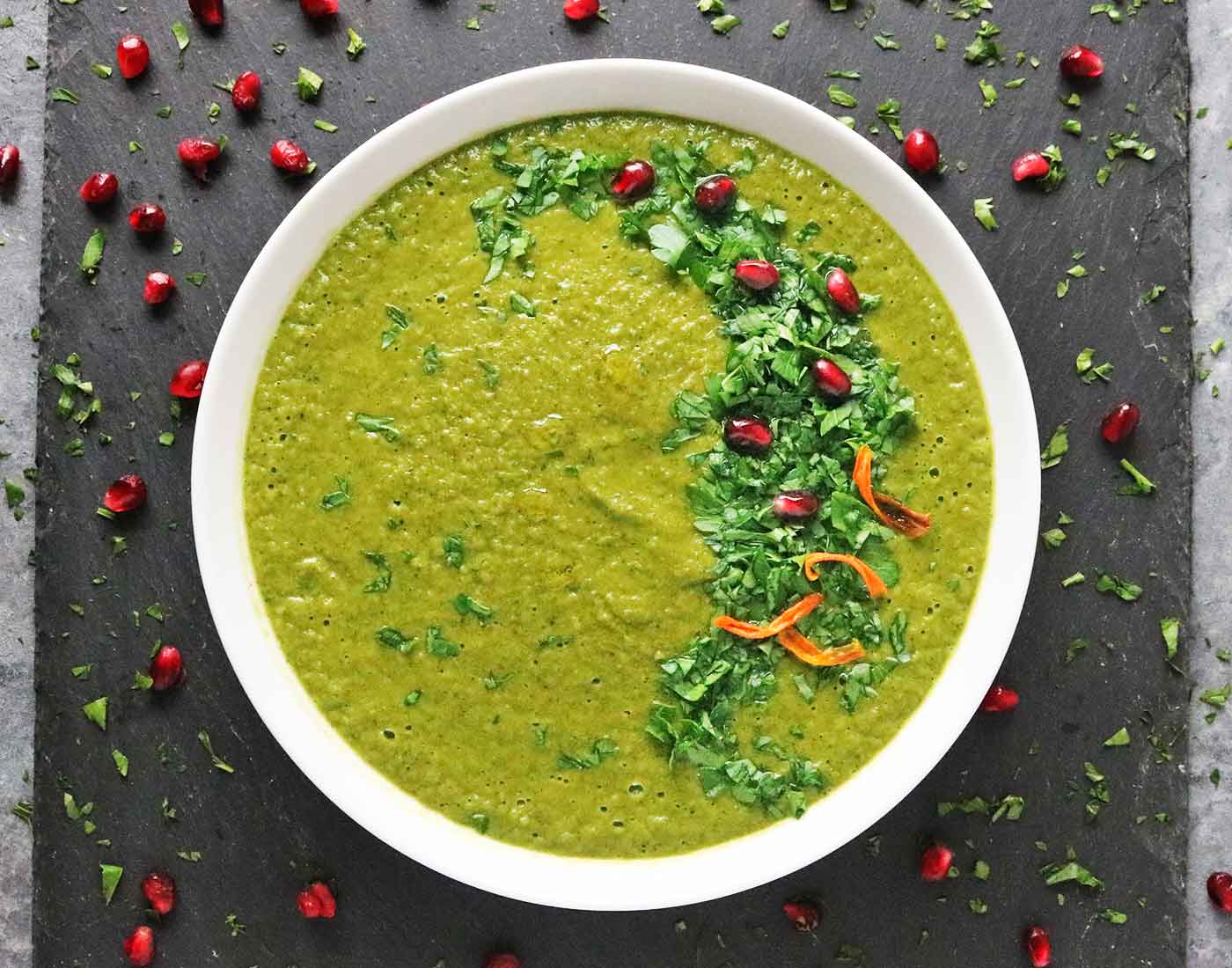 Overhead view of Green Soup in white bowl.