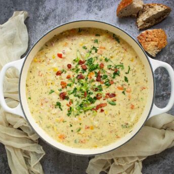 Overhead view of Ham and Corn Chowder in a large soup pot.