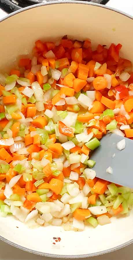 Sauteeing the aromatic veggies in the soup pot.