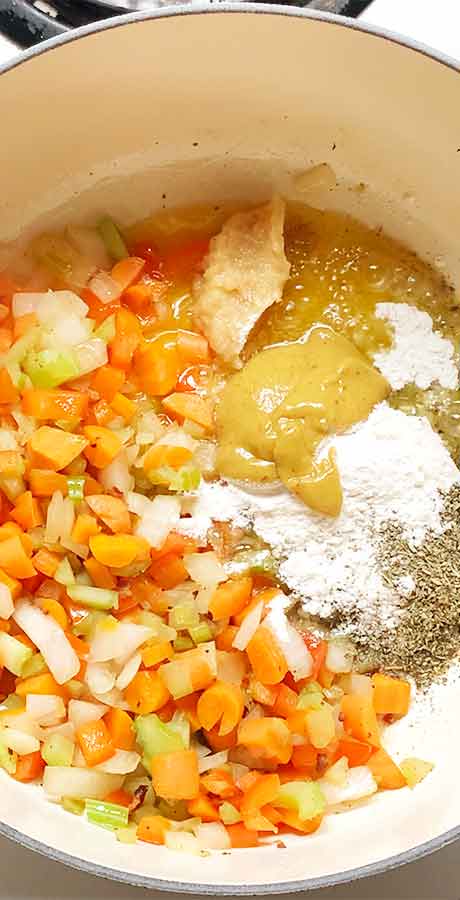 Adding the seasonings to the pot.