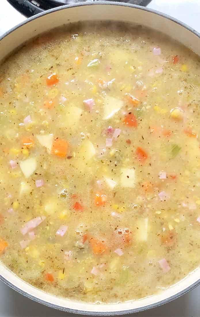 Cooking the soup with the potatoes and ham added.