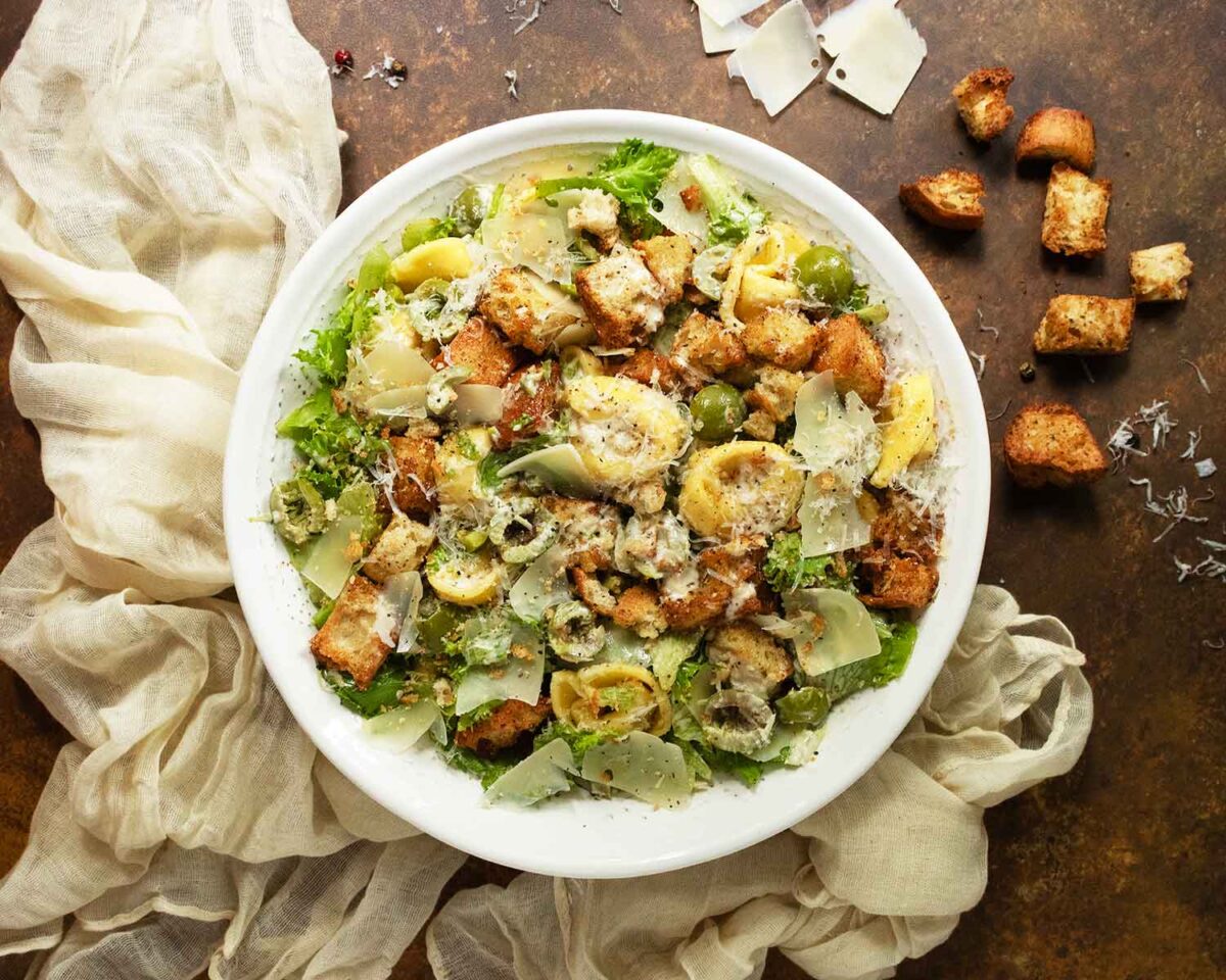 View from the top of a bowl of Tortellini Caesar Salad.