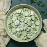 Overhead view of a bowl of Creamy Tzatziki Cucumber Salad